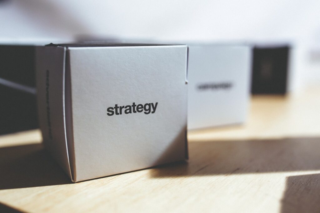 A small cardboard box with the word strategy